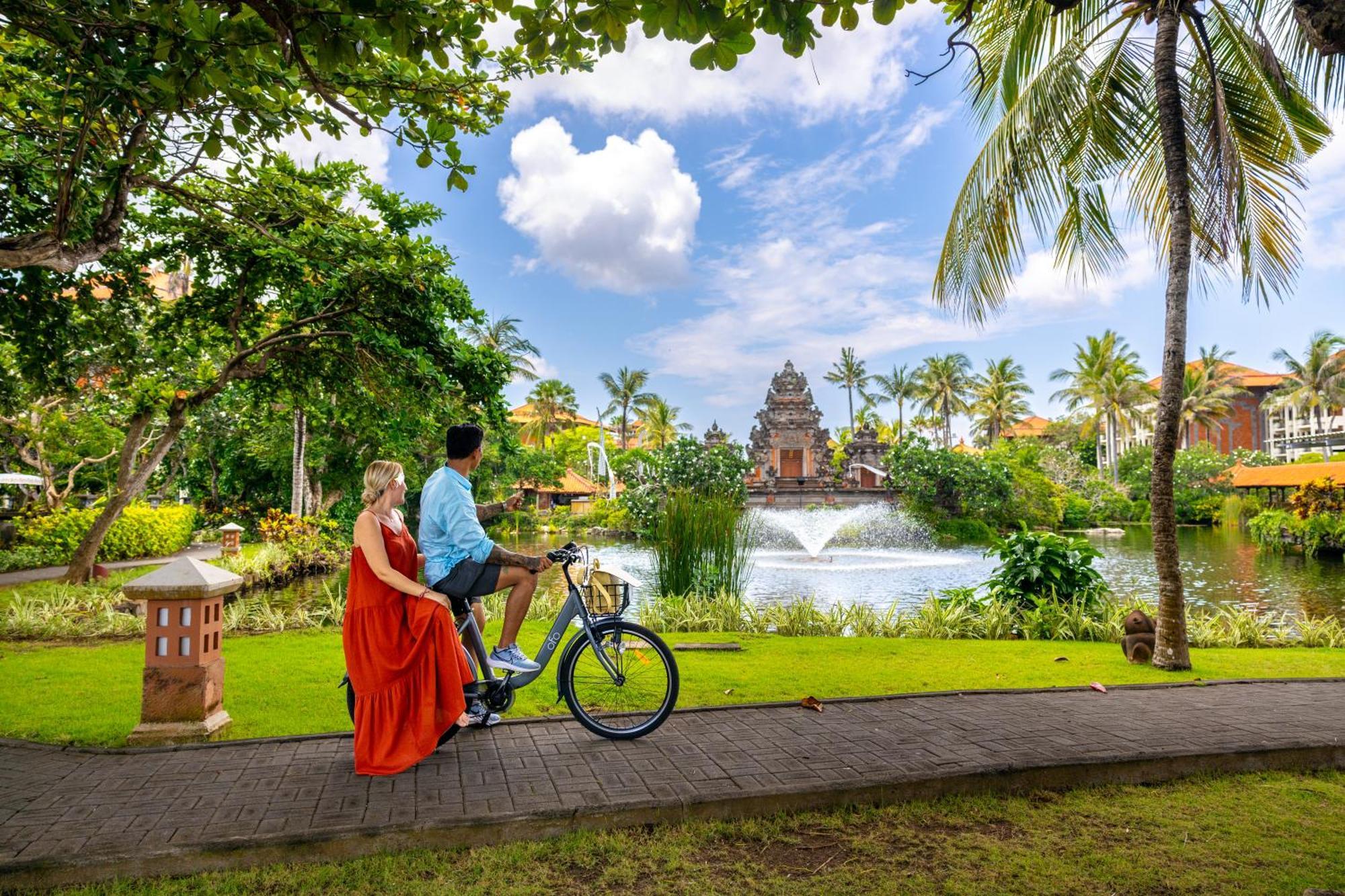 Ayodya Resort Bali Nusa Dua  Exterior foto A couple cycling in Bali